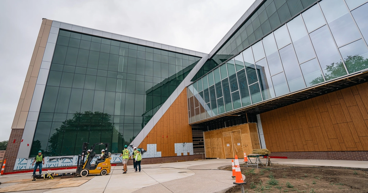 An exterior view of the main entrance of the Student Recreation and Wellness Center. 
